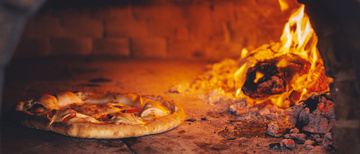 Dégustez nos délicieuses pizzas au feu de bois